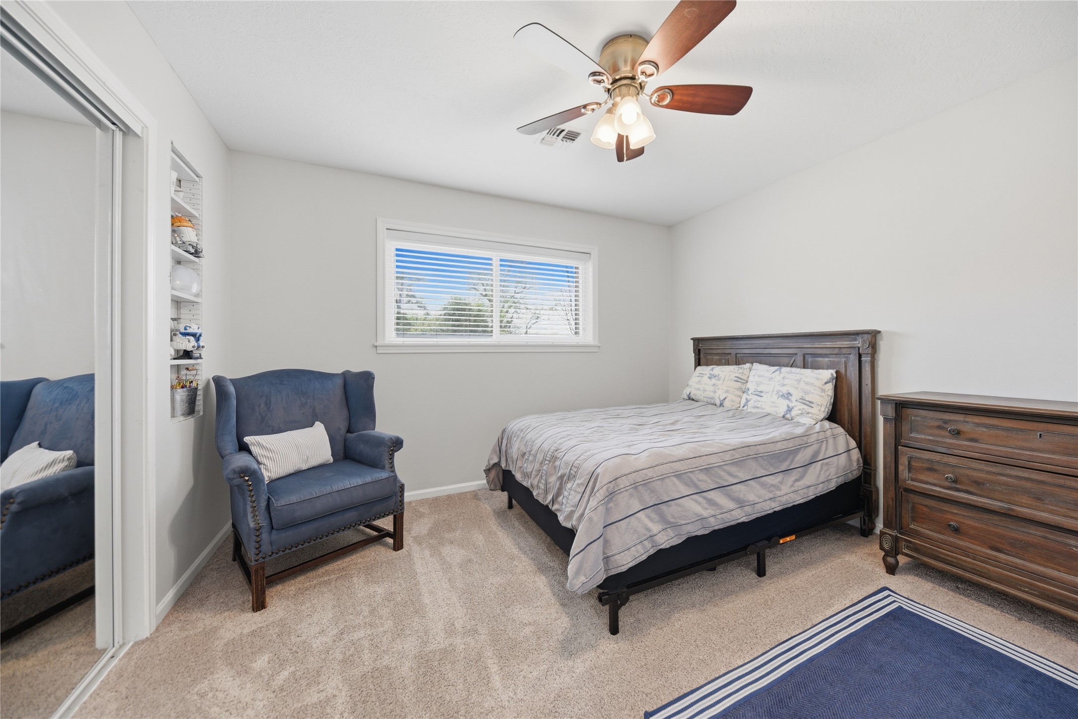 207 Briar Ridge Drive Bellville, TX 77418 - Photo 24 of 36 a bedroom with a large bed couch and a window