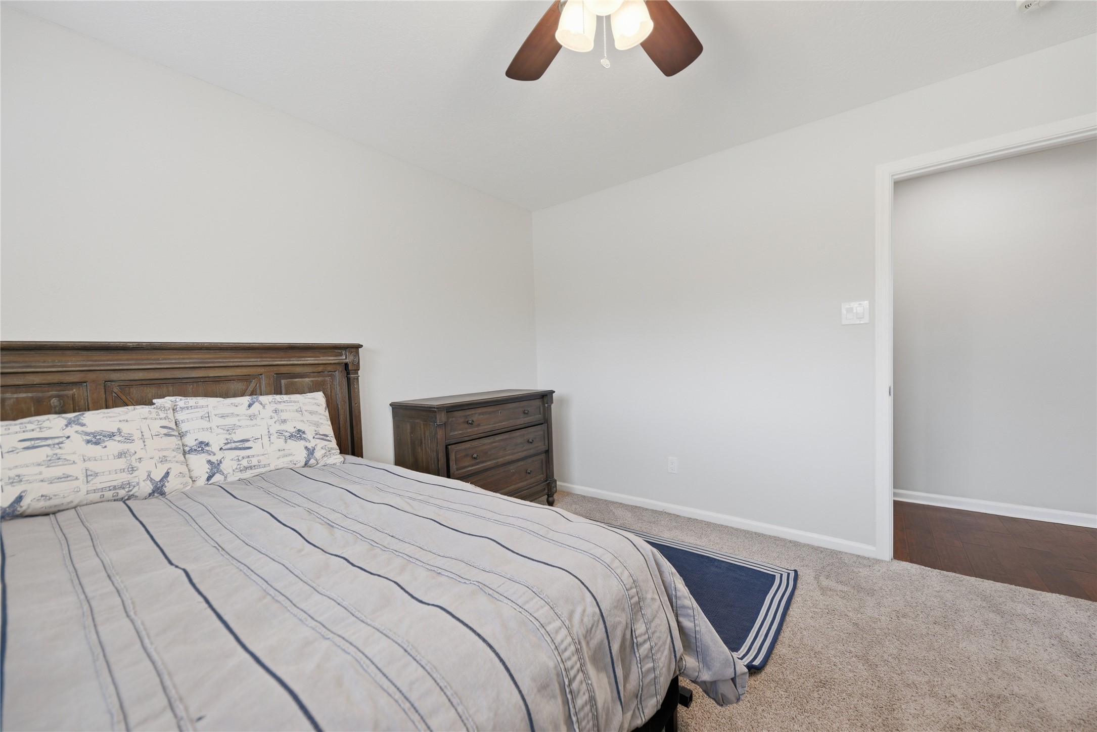 207 Briar Ridge Drive Bellville, TX 77418 - Photo 26 of 36 a bedroom with a bed and a large window