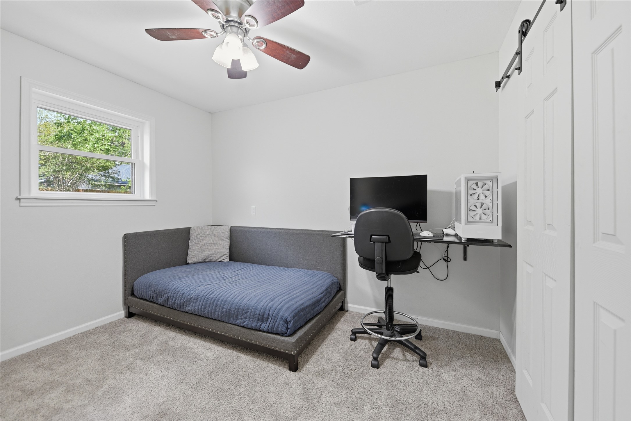 207 Briar Ridge Drive Bellville, TX 77418 - Photo 27 of 36 a living room with a couch and a window