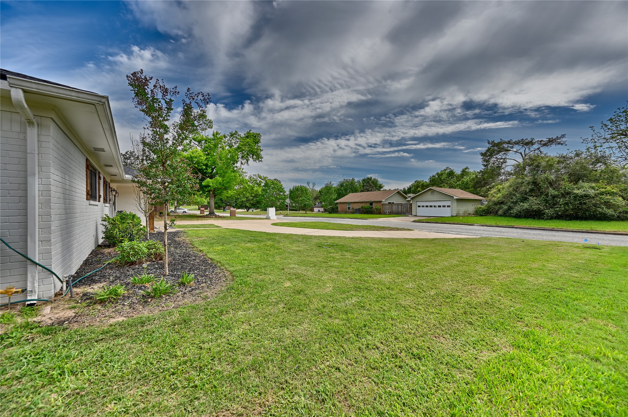 207 Briar Ridge Drive Bellville, TX 77418 - Photo 5 of 36 a view of a garden