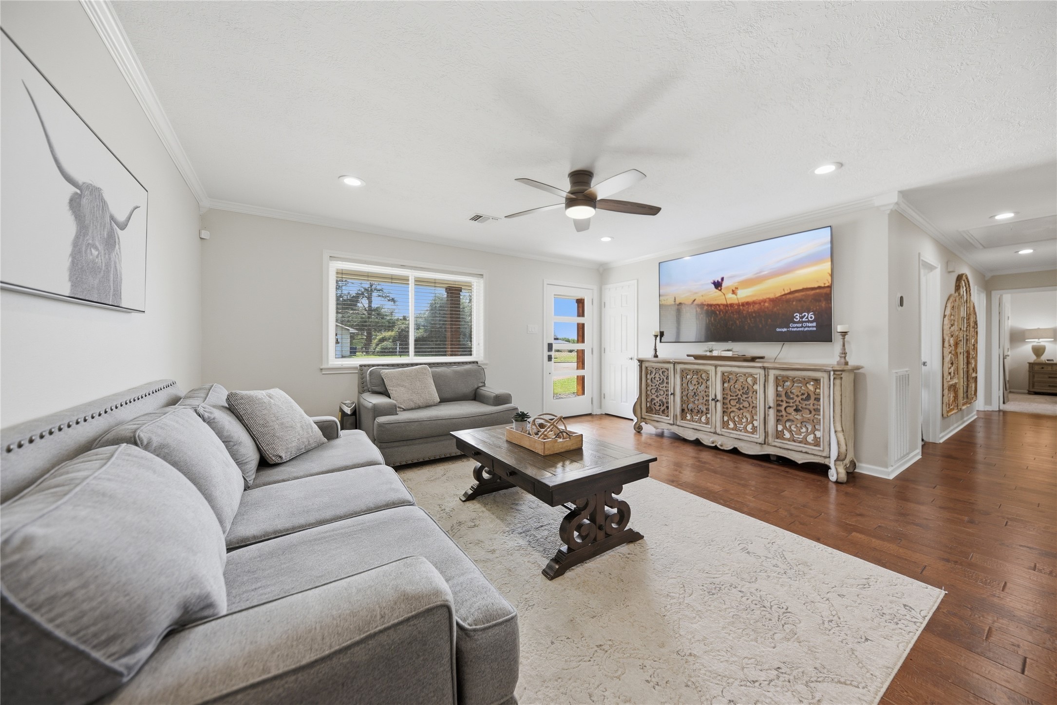 207 Briar Ridge Drive Bellville, TX 77418 - Photo 8 of 36 a living room with furniture and a flat screen tv