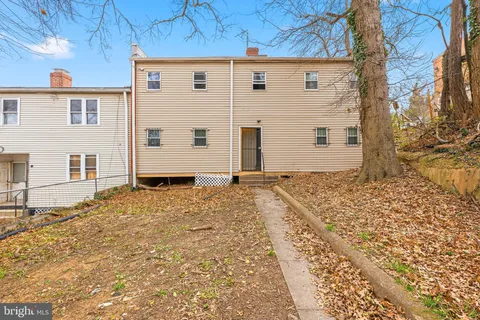 a view of backyard of a house