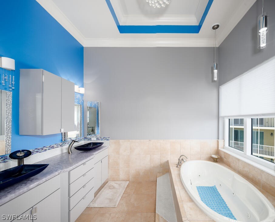 2797 First Street, Unit 2101 Fort Myers, FL 33916 - Photo 14 of 26 a bathroom with a tub sink and a mirror