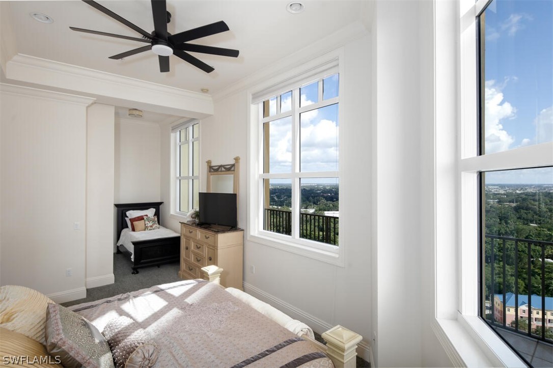 2797 First Street, Unit 2101 Fort Myers, FL 33916 - Photo 16 of 26 a bedroom with a bed and a window