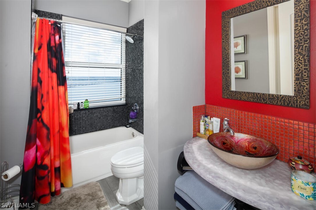 2797 First Street, Unit 2101 Fort Myers, FL 33916 - Photo 17 of 26 a bathroom with a sink toilet and shower