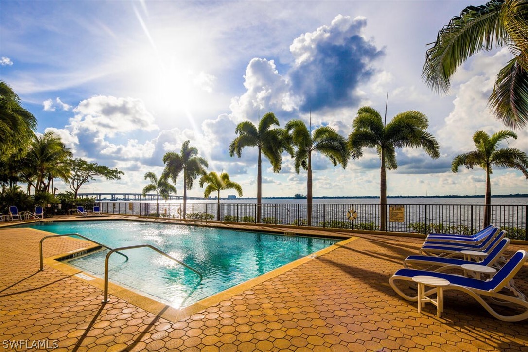 2797 First Street, Unit 2101 Fort Myers, FL 33916 - Photo 20 of 26 a view of swimming pool with seating area and garden
