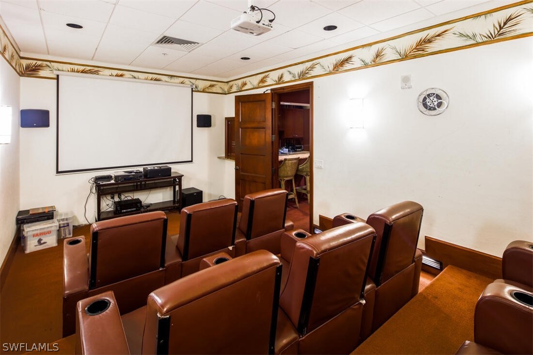 2797 First Street, Unit 2101 Fort Myers, FL 33916 - Photo 21 of 26 a room with furniture and a projector screen