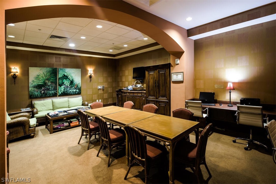 2797 First Street, Unit 2101 Fort Myers, FL 33916 - Photo 23 of 26 a kitchen with a table and chairs in it
