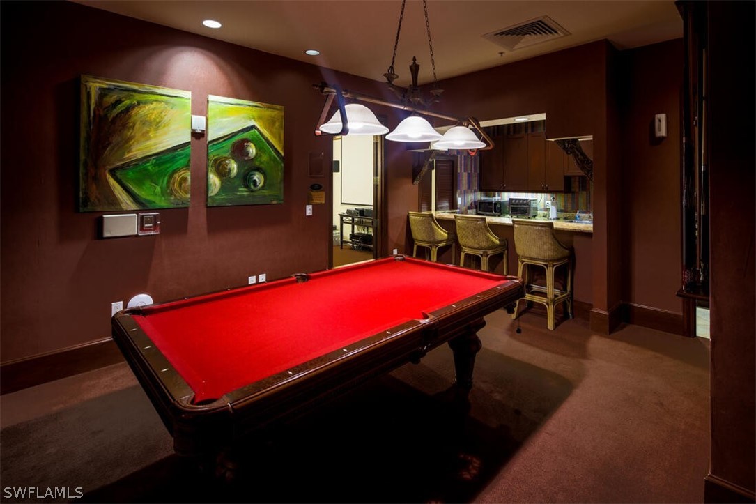 2797 First Street, Unit 2101 Fort Myers, FL 33916 - Photo 24 of 26 a room with pool table and windows
