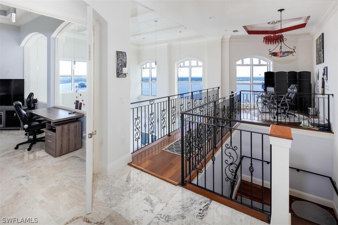 2797 First Street, Unit 2101 Fort Myers, FL 33916 - Photo 8 of 26 a view of a hallway with workspace and windows
