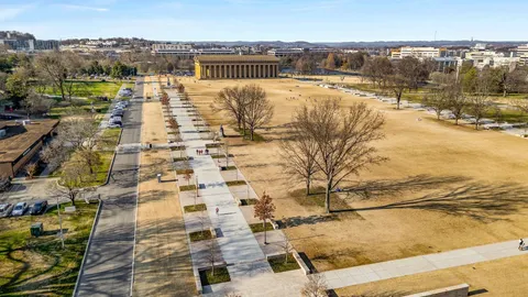 a view of a terrace with wooden floor and lake view