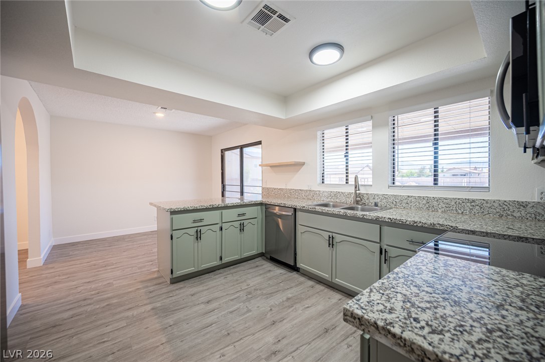 7041 North Decatur Boulevard Las Vegas, NV 89131 - Photo 9 of 33 A well-appointed kitchen features abundant counter space and durable flooring.