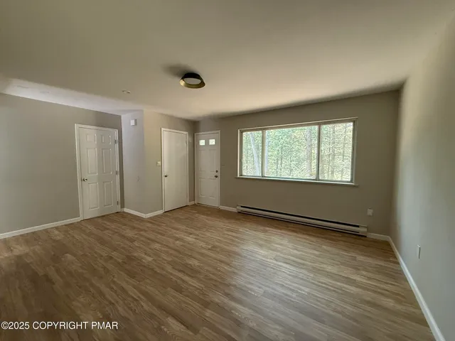 a kitchen with stainless steel appliances a cabinets a sink and a counter top space