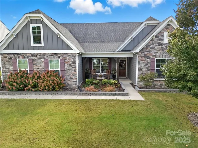 a view of a house with swimming pool and porch