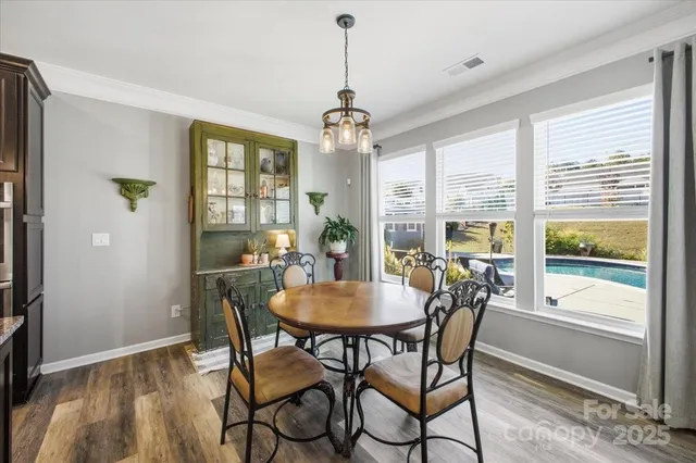 a bedroom with a bed a couch and dresser