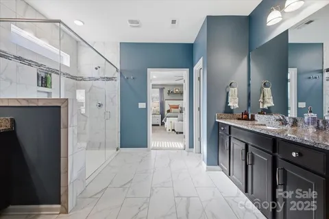 a bedroom with furniture and a window