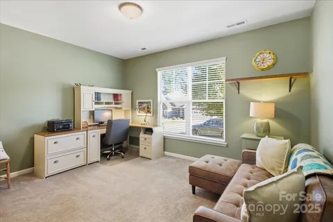 a bedroom with furniture and a window