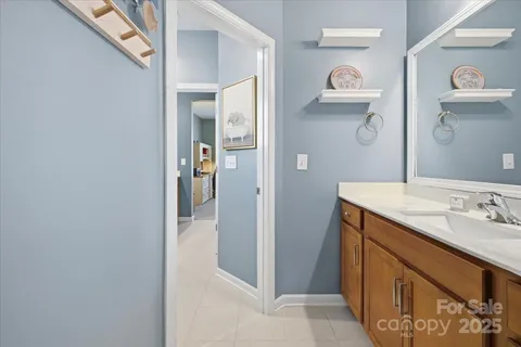 a bedroom with furniture and wooden floor