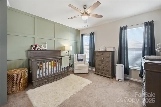 a view of a hallway with seating area and front door