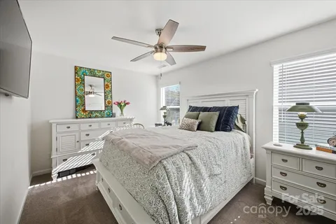 a living room with furniture a rug and a chandelier