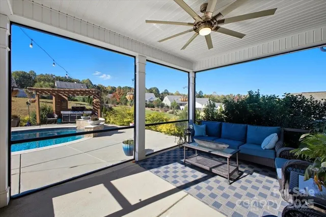 a outdoor living space with furniture and a potted plant