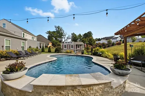 a view of a house with couches in the patio