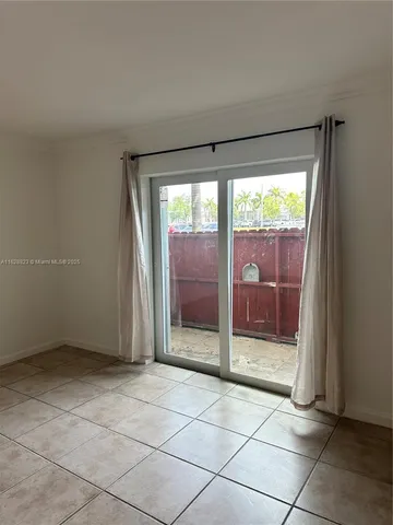 a view of a bathroom with a glass door