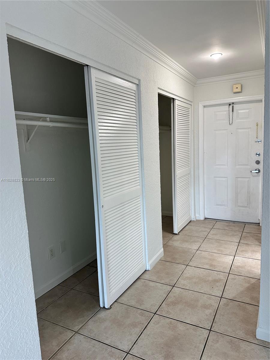 8600 Southwest 67th Avenue, Unit 908 Pinecrest, FL 33156 - Photo 16 of 25 an empty room with a wooden door