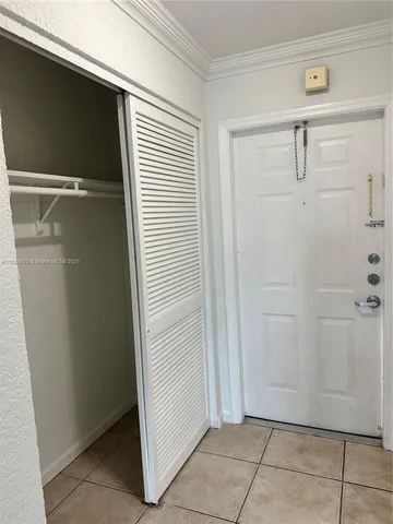 a white refrigerator freezer and a refrigerator in a kitchen