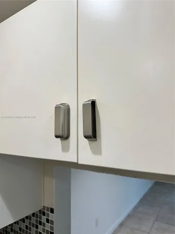 a white refrigerator freezer sitting inside of a kitchen