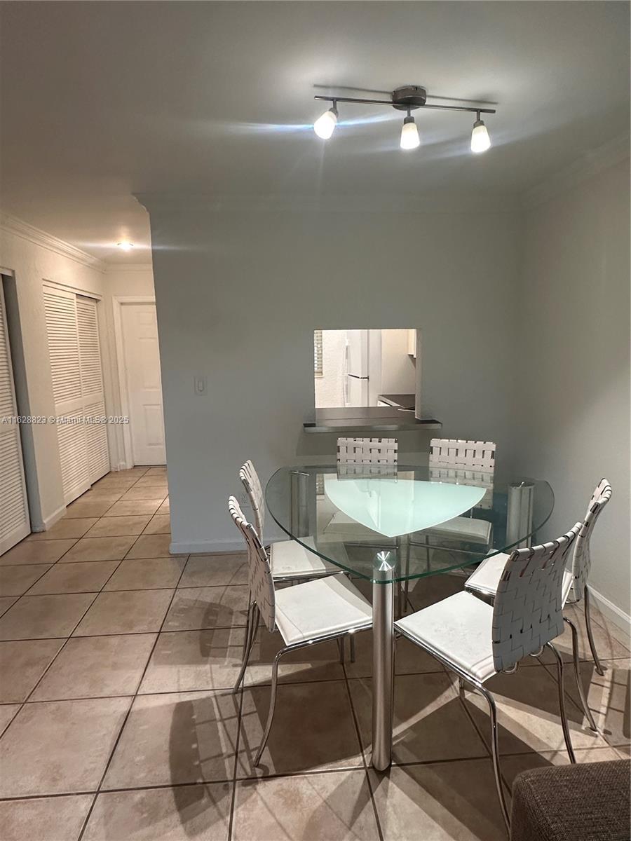 8600 Southwest 67th Avenue, Unit 908 Pinecrest, FL 33156 - Photo 24 of 25 a view of a kitchen area with furniture