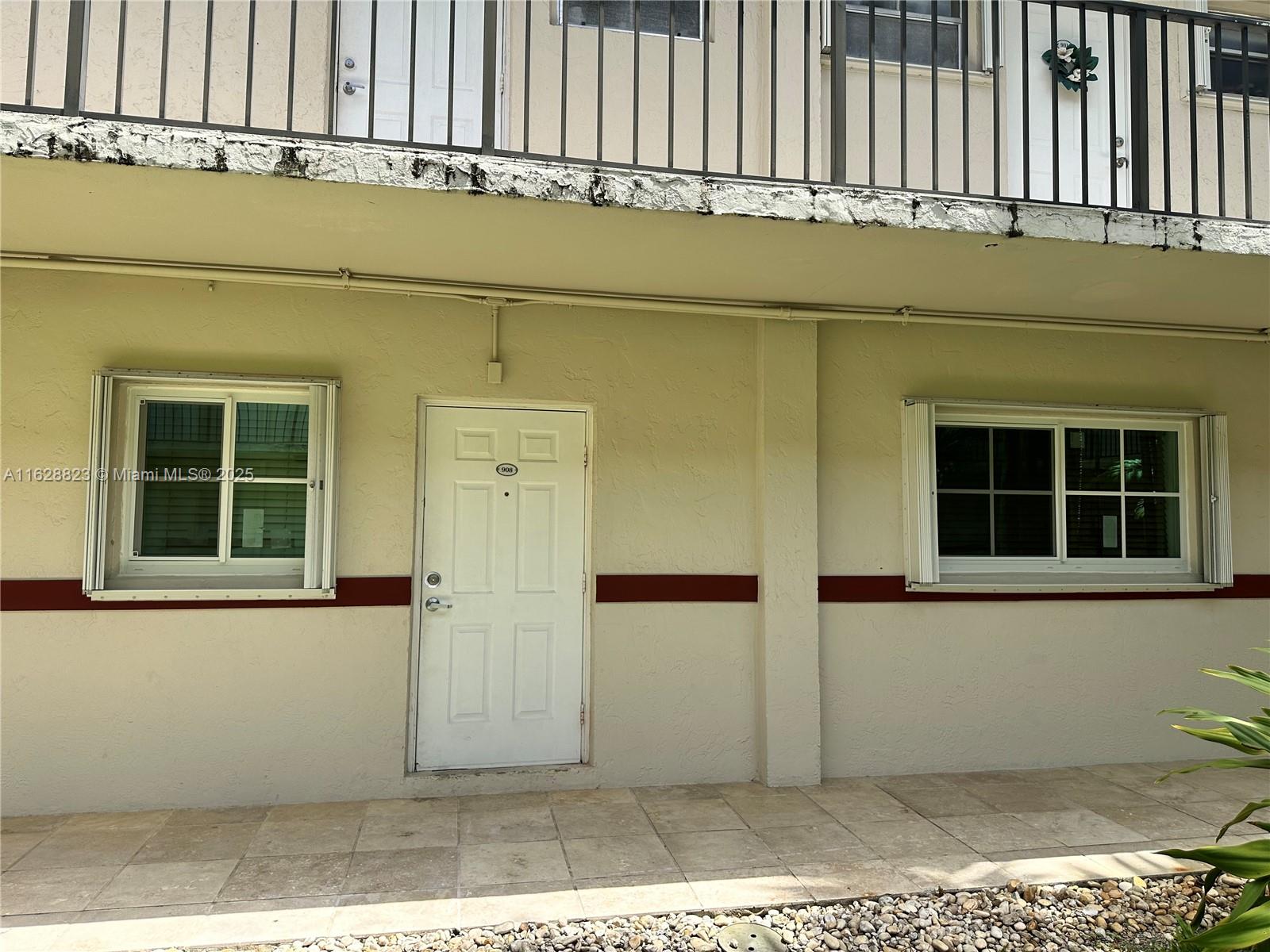 8600 Southwest 67th Avenue, Unit 908 Pinecrest, FL 33156 - Photo 4 of 25 front view of a house with a window
