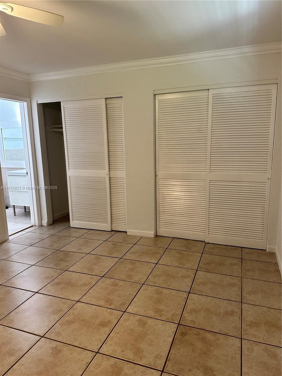 8600 Southwest 67th Avenue, Unit 908 Pinecrest, FL 33156 - Photo 9 of 25 a view of a livingroom with an empty space and a window