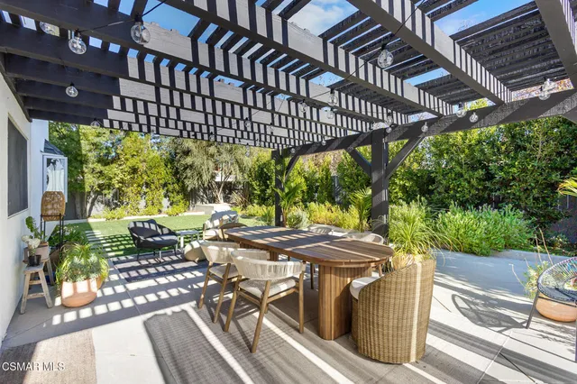 a view of a chairs and table in the patio