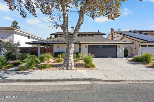 front view of a house with a small yard