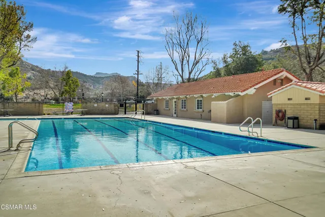 a view of swimming pool with a patio