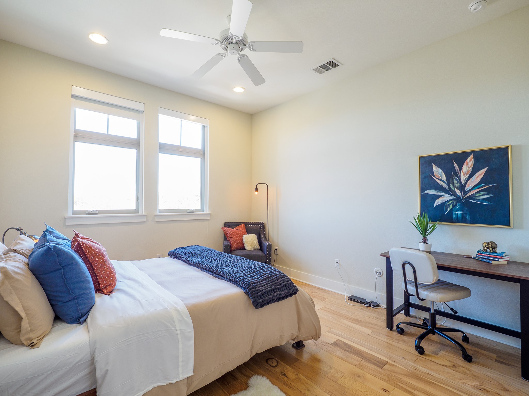 908 Nueces Street, Unit 44 Austin, TX 78701 - Photo 17 of 29 Bedroom with light wood-style flooring, a ceiling fan, recessed lighting, and an office area
