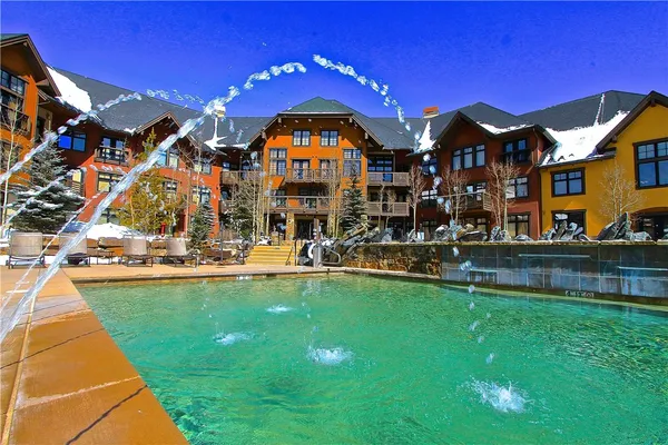a view of swimming pool with outdoor seating