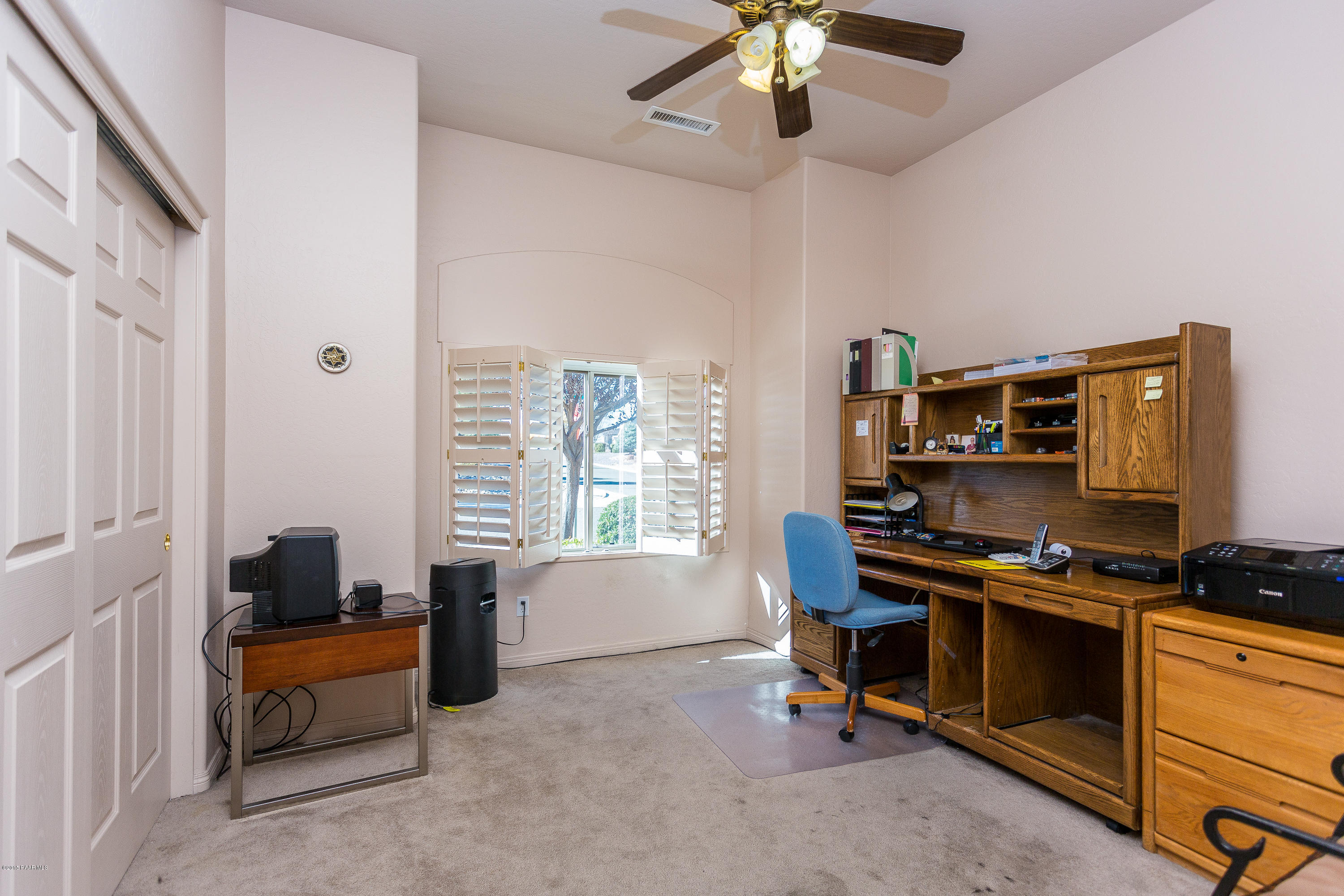 7861 North Rambling Lane Prescott Valley, AZ 86315 - Photo 12 of 15 a view of a workspace with furniture and a window