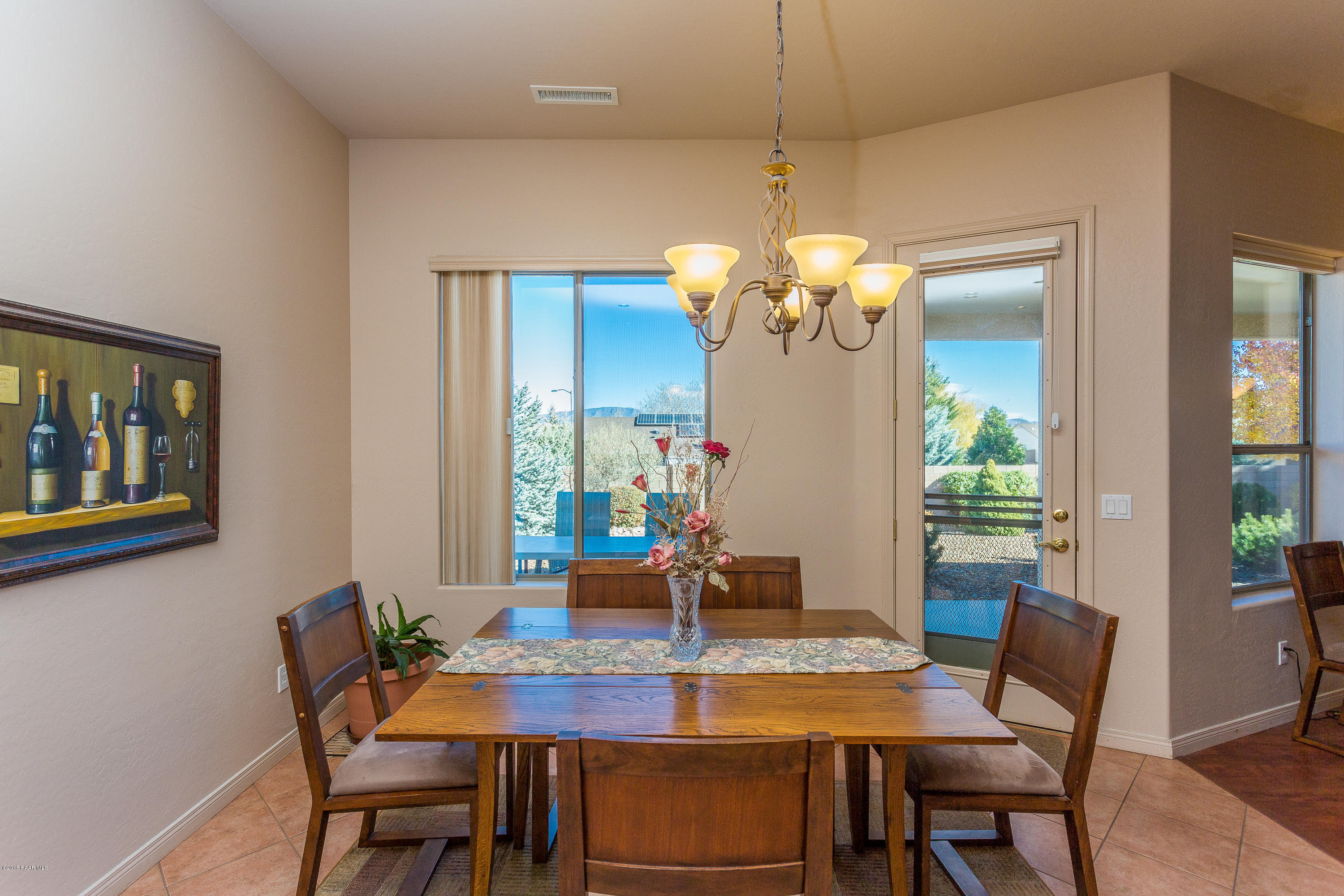 7861 North Rambling Lane Prescott Valley, AZ 86315 - Photo 7 of 15 a view of a dining room with a table and chairs