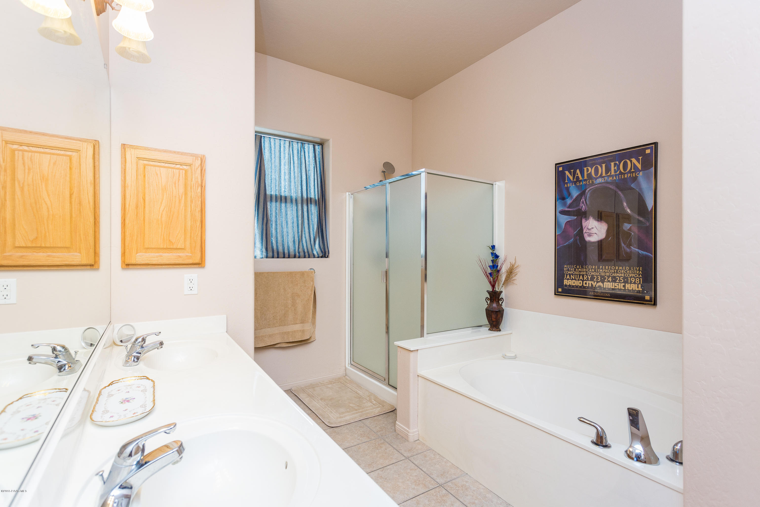 7861 North Rambling Lane Prescott Valley, AZ 86315 - Photo 9 of 15 a bathroom with a tub sink and mirror