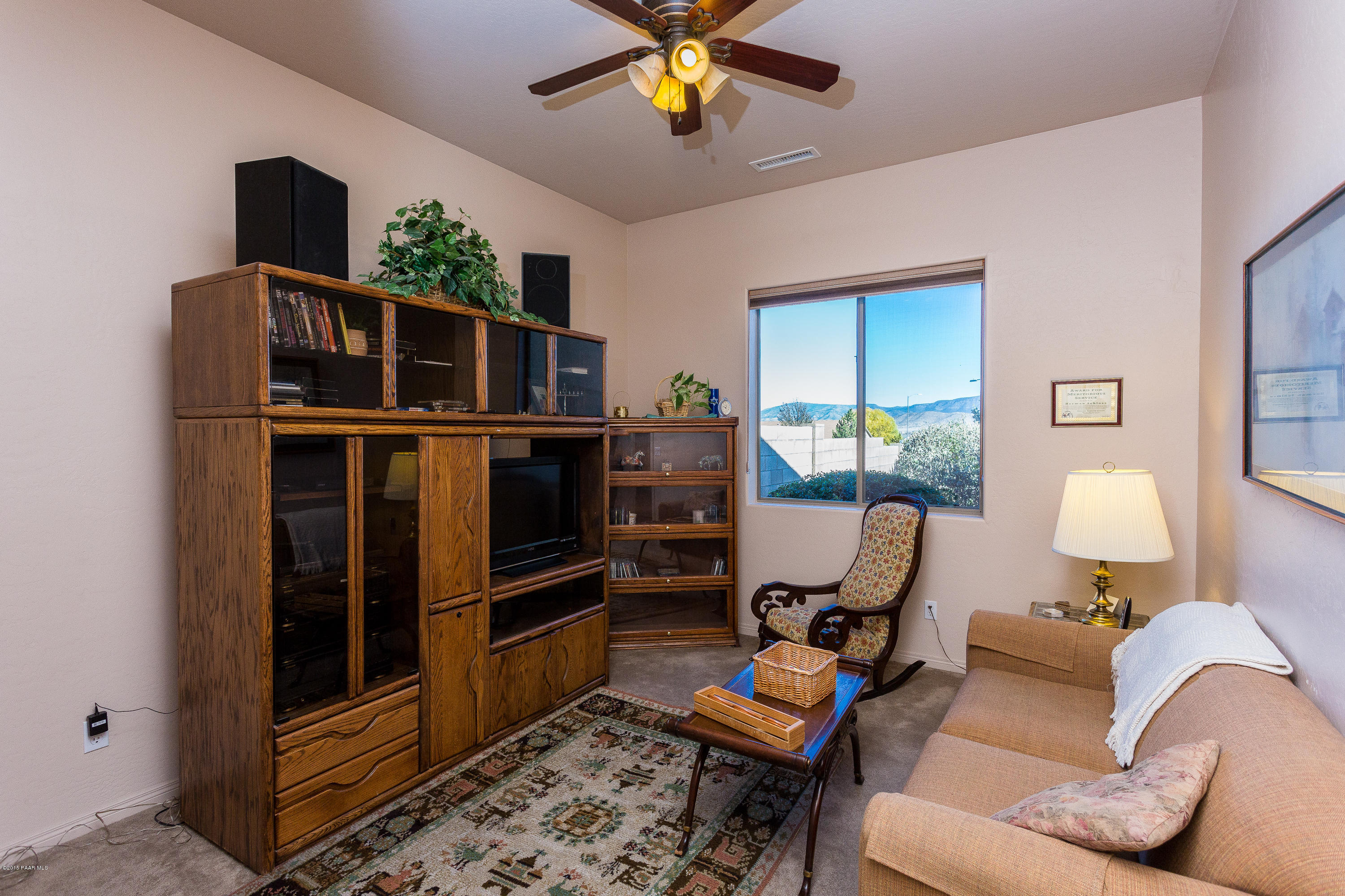 7861 North Rambling Lane Prescott Valley, AZ 86315 - Photo 10 of 15 a living room with furniture and a flat screen tv