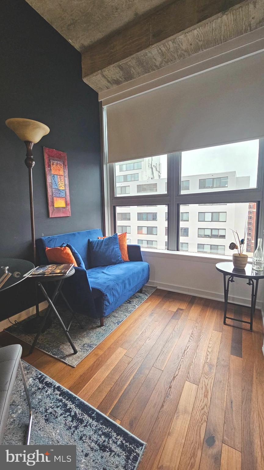 1300 N Street Northwest, Unit 713 Washington, DC 20005 - Photo 15 of 33 a living room with furniture and a large window