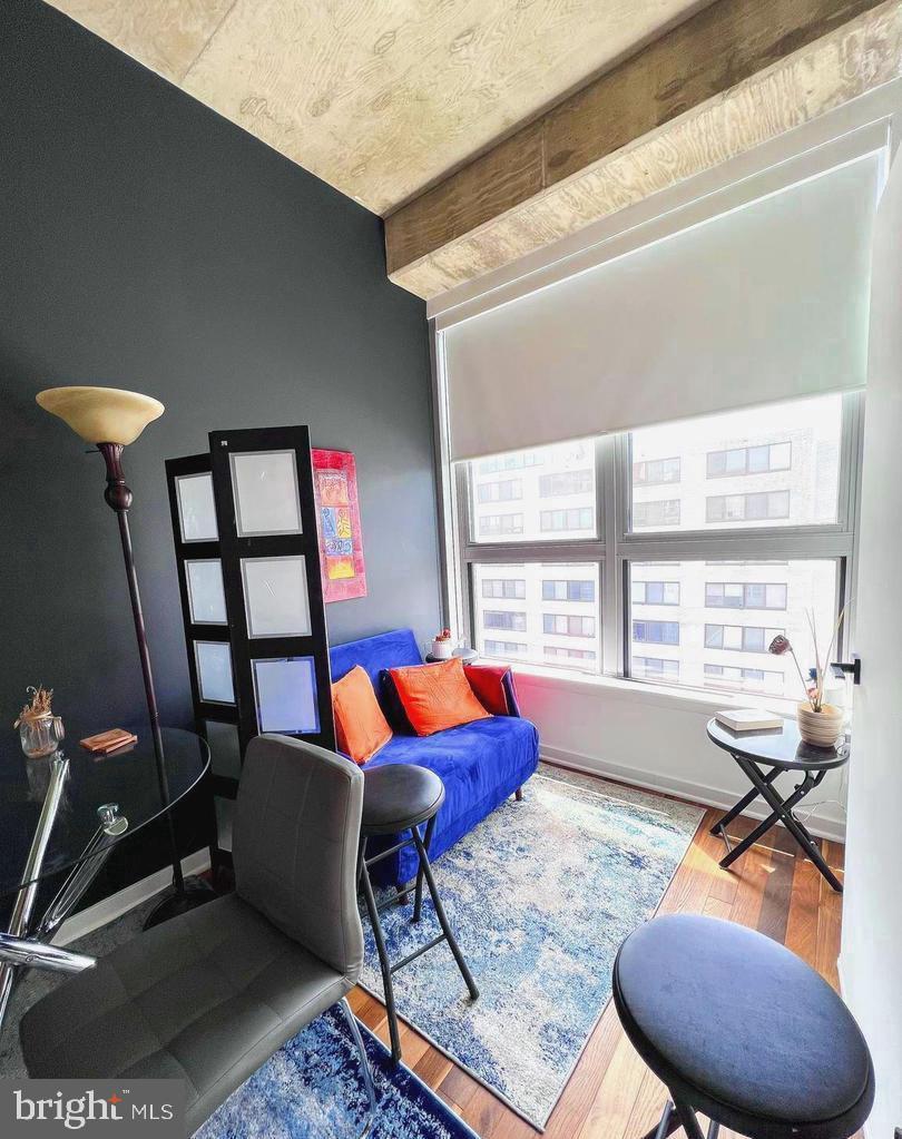 1300 N Street Northwest, Unit 713 Washington, DC 20005 - Photo 17 of 38 a living room with furniture and a large window