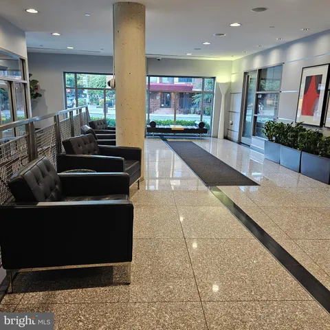 a view of a living room and a balcony