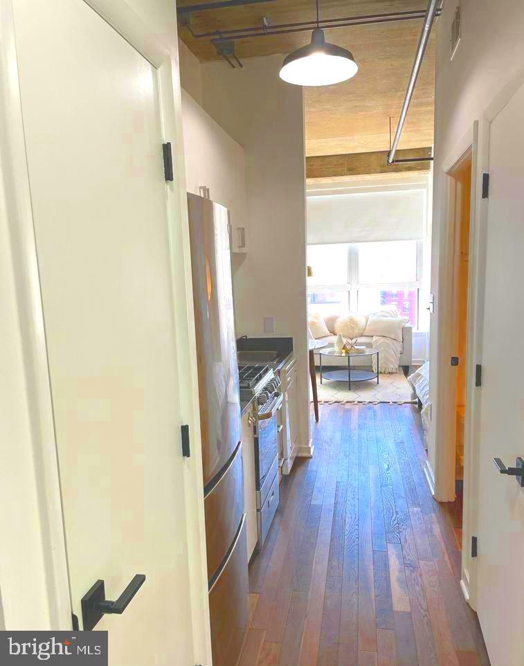 1300 N Street Northwest, Unit 713 Washington, DC 20005 - Photo 7 of 38 a view of a living room with a wooden floor