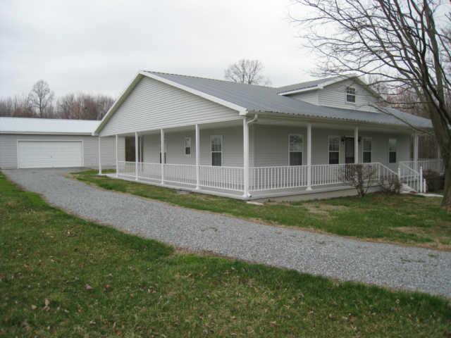 7004 Williams Road Cross Plains, TN 37049 - Photo 2 of 18 a view of a house with a yard and plants