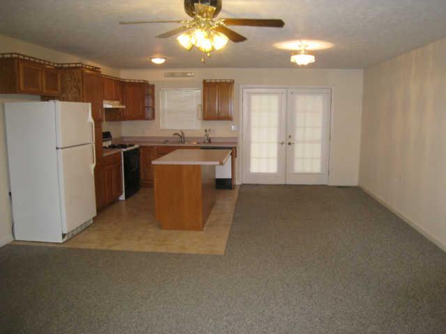 7004 Williams Road Cross Plains, TN 37049 - Photo 11 of 18 a kitchen with refrigerator and cabinets
