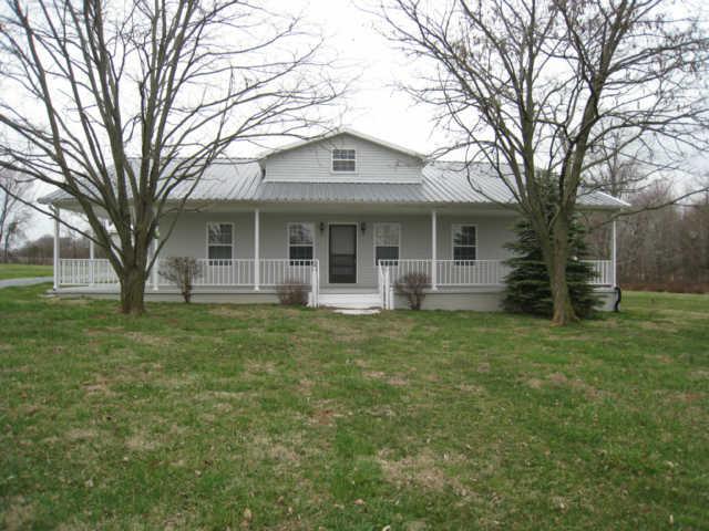 7004 Williams Road Cross Plains, TN 37049 - Photo 3 of 18 a front view of house with yard and green space