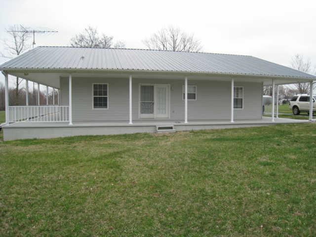 7004 Williams Road Cross Plains, TN 37049 - Photo 5 of 18 a front view of a house with garden